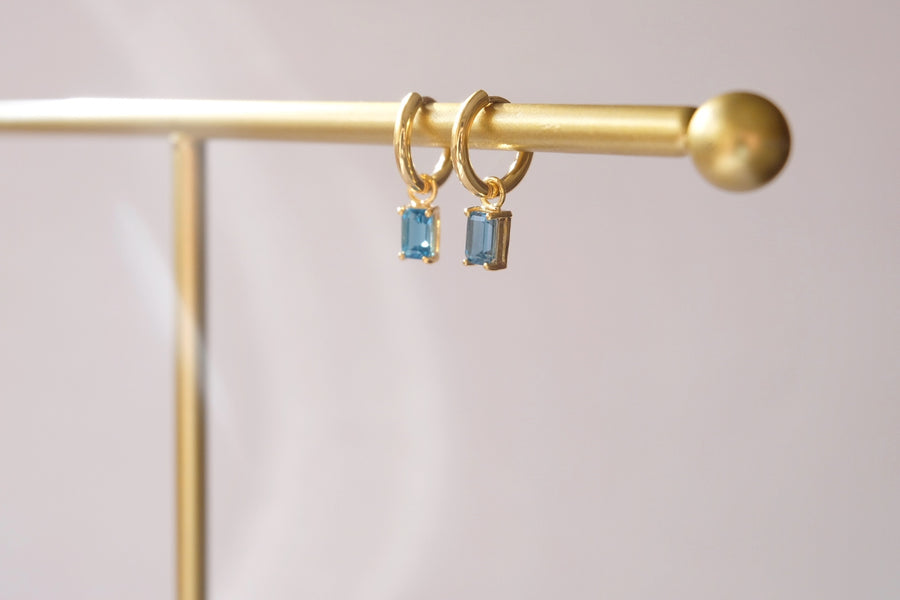 Dangling hoops with Emerald Cut birthstone charm