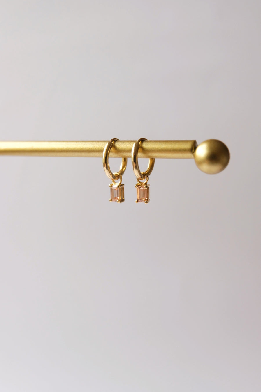 Dangling hoops with Emerald Cut birthstone charm