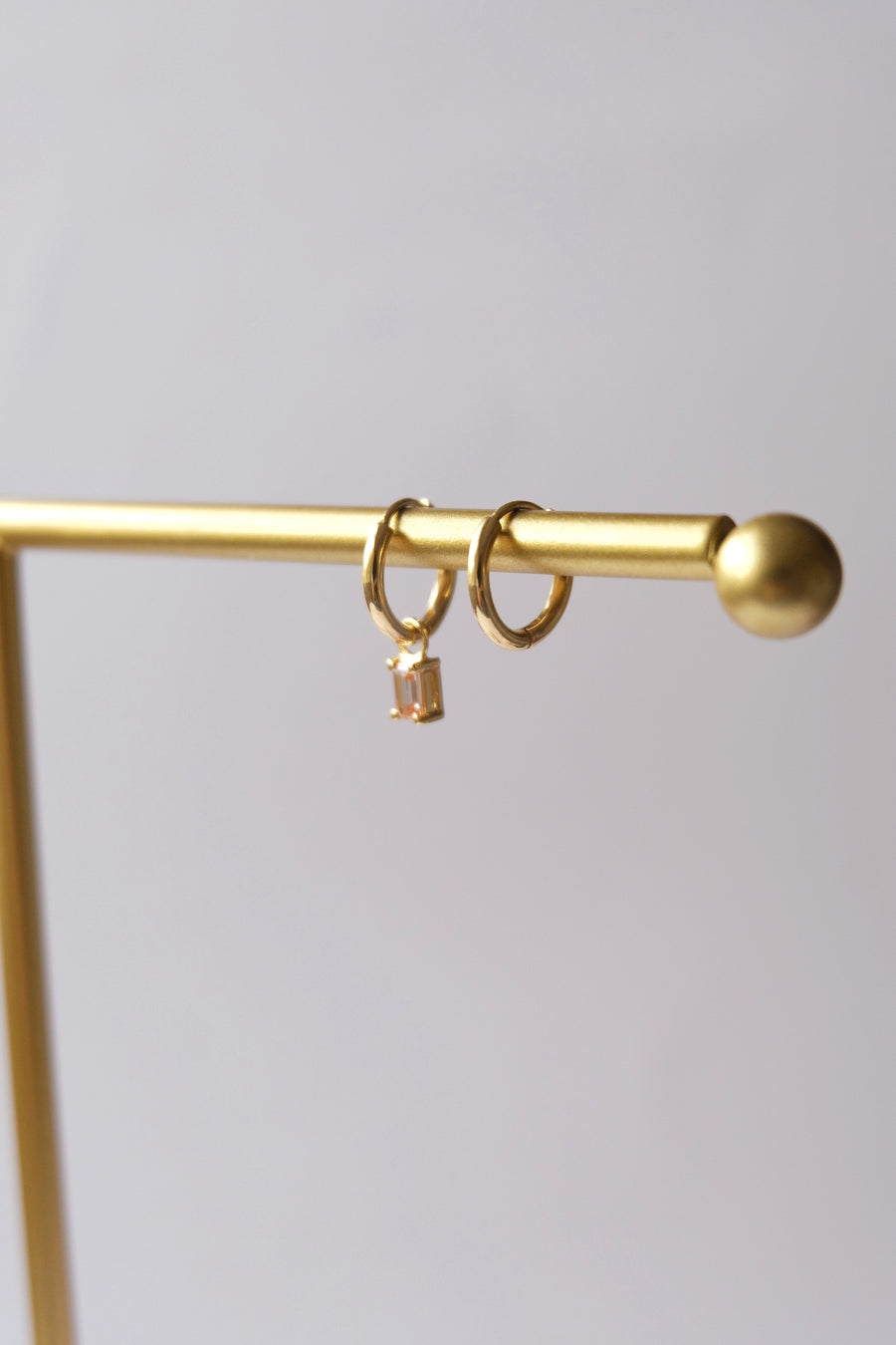 Dangling hoops with Emerald Cut birthstone charm