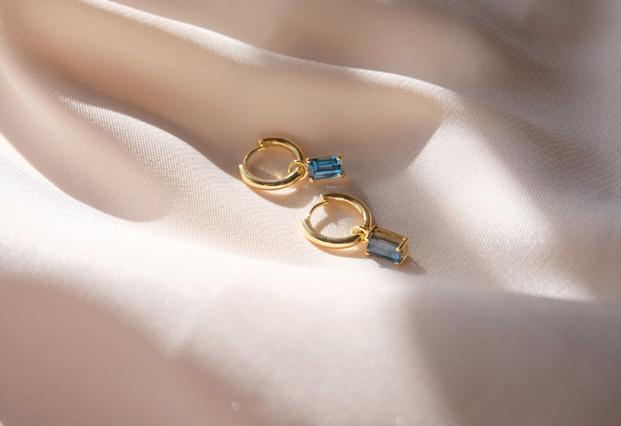 Dangling hoops with Emerald Cut birthstone charm