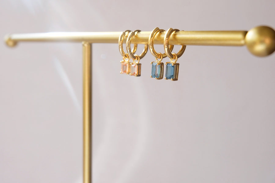 Dangling hoops with Emerald Cut birthstone charm
