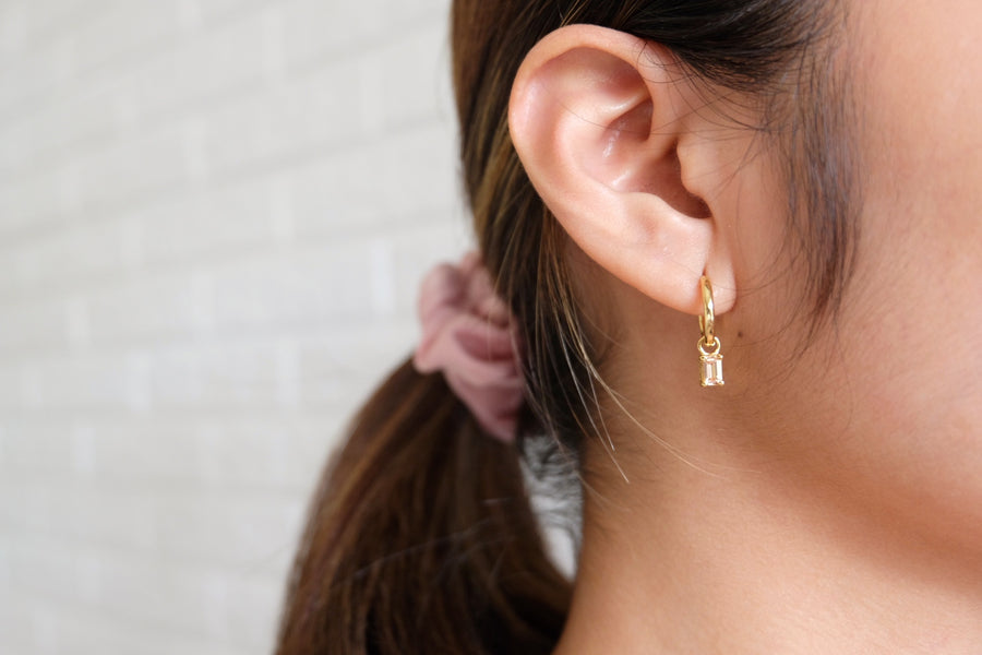Dangling hoops with Emerald Cut birthstone charm