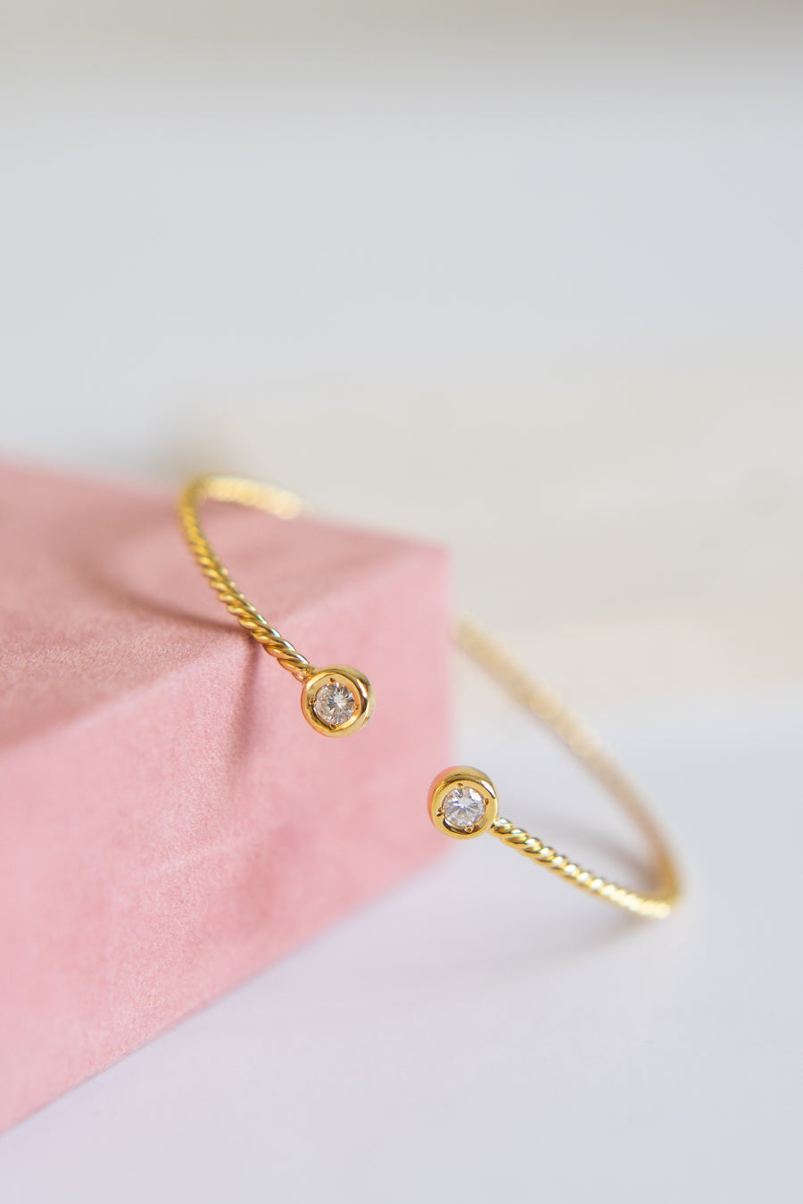 14 Karat Twisted Bangle with Natural Diamonds
