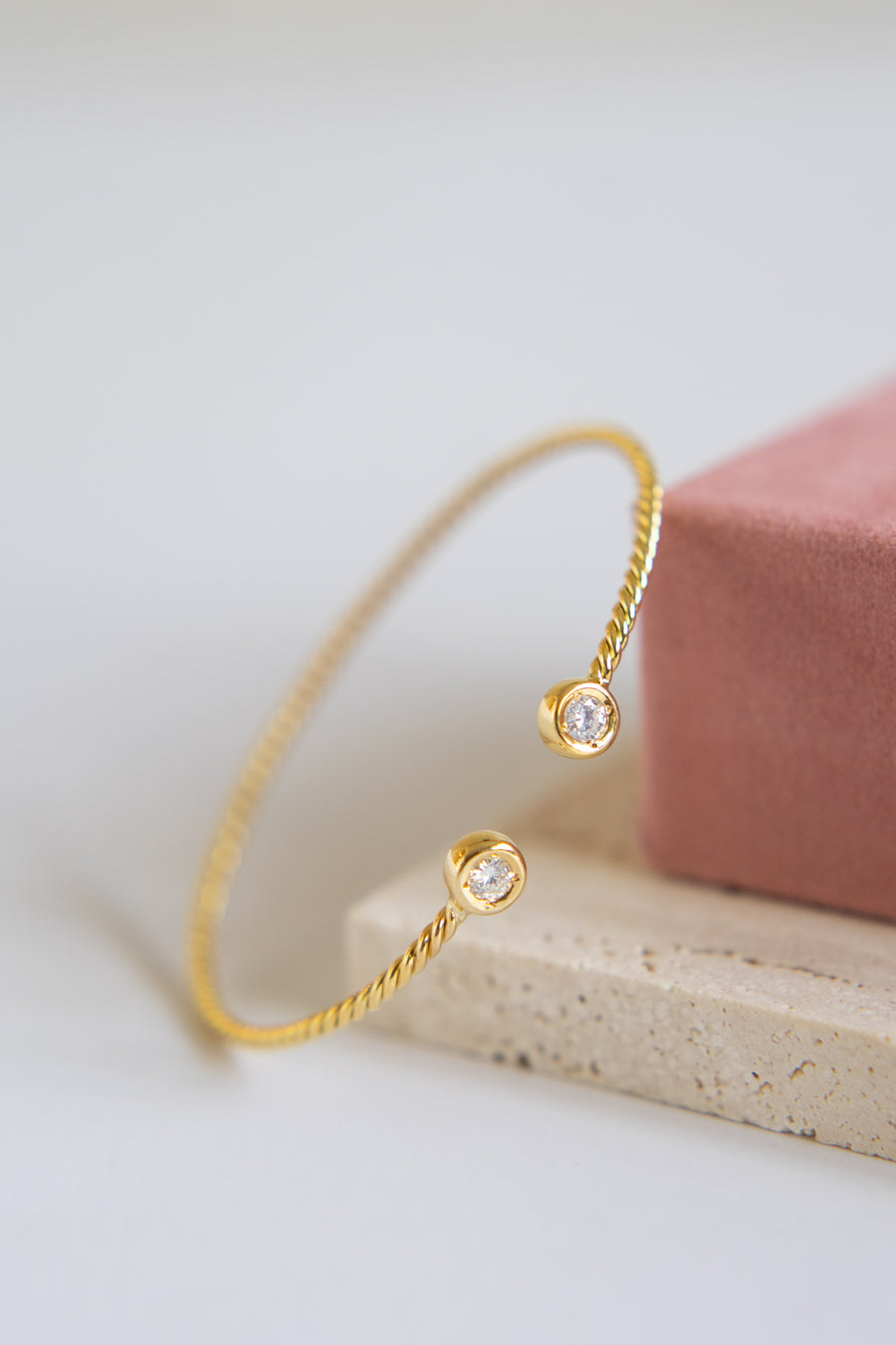14 Karat Twisted Bangle with Natural Diamonds