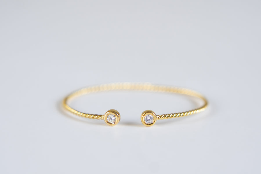 14 Karat Twisted Bangle with Natural Diamonds