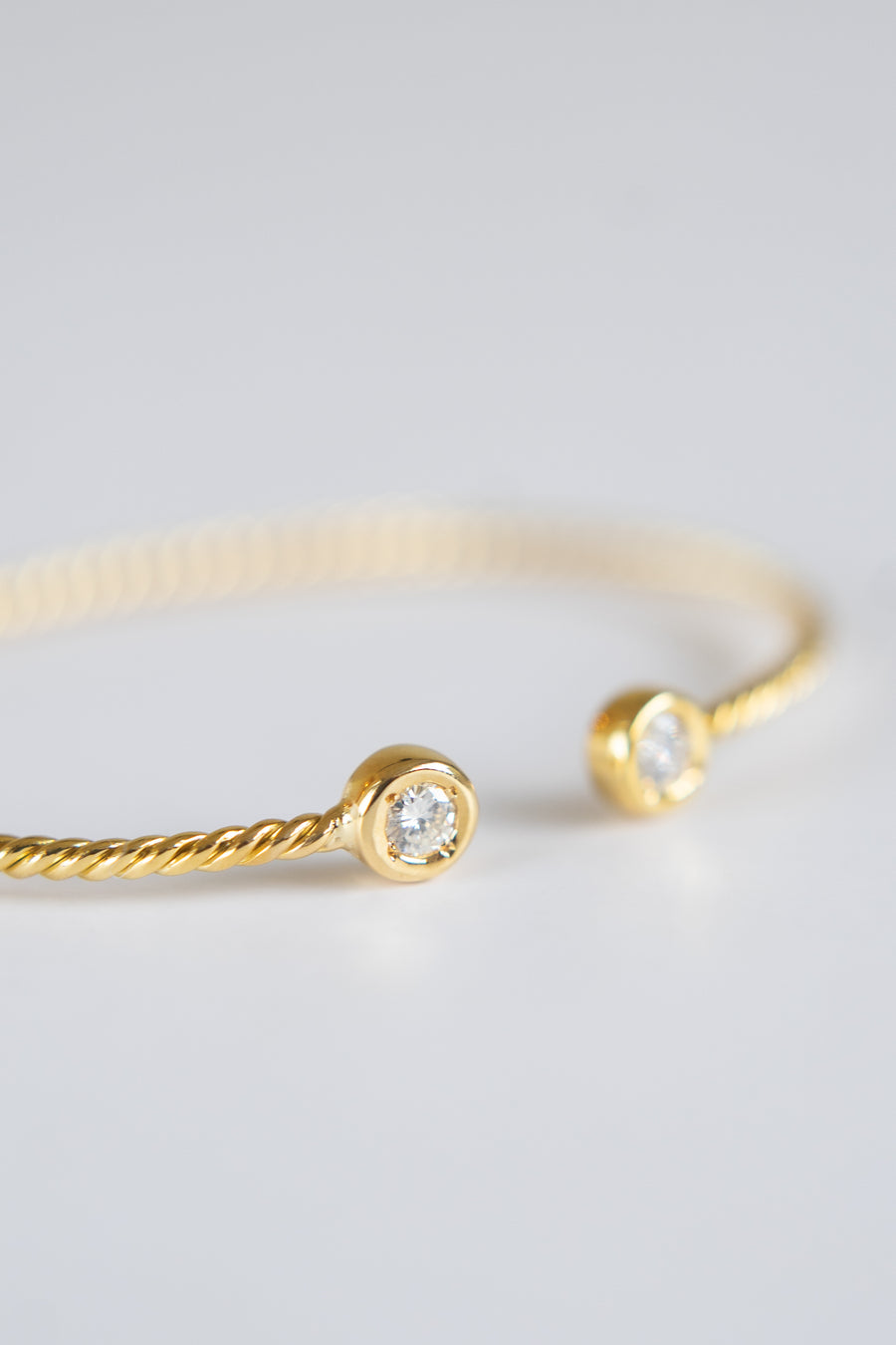 14 Karat Twisted Bangle with Natural Diamonds
