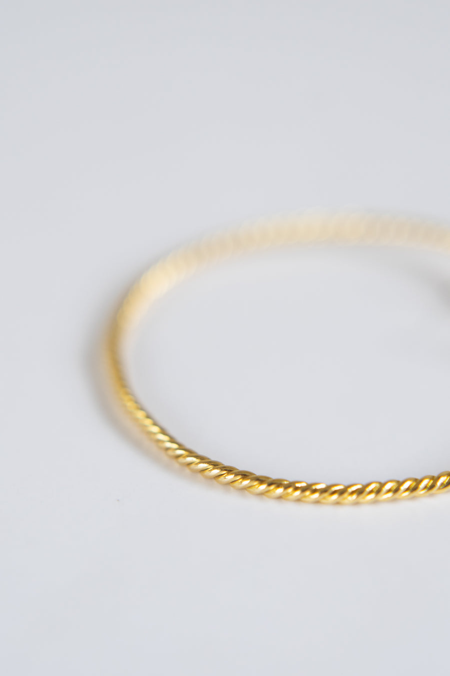 14 Karat Twisted Bangle with Natural Diamonds
